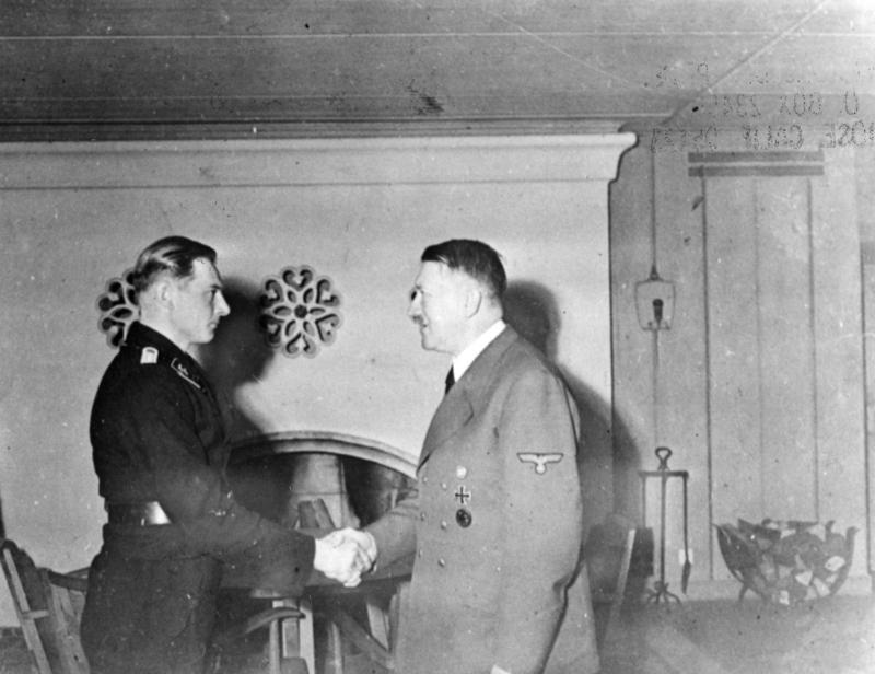 Adolf Hitler awards the Knight's Cross of the Iron Cross with Oak Leaves to tank commander Michael Wittmann in FHQ Wolfsschanze